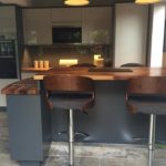 Walnut chairs and worktop. Modern kitchen from DIY Kitchens