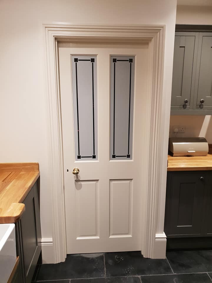 Architrave and door including furnishings